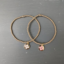 3mm gold filled bracelet with raised flower charm