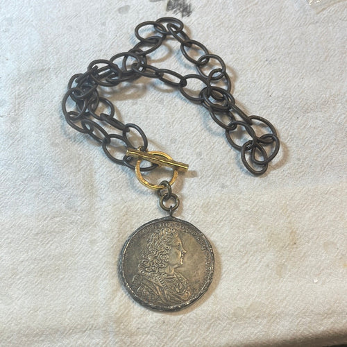 Replica dollar pendant with antique toggle necklace