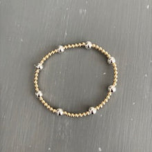3mm gold filled bracelet w/ 8 6mm gold filled beads