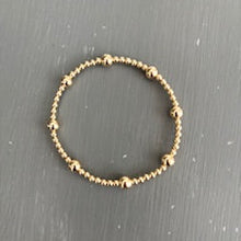 3mm gold filled bracelet w/ 8 6mm gold filled beads