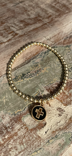 Black charm gold cross bracelet